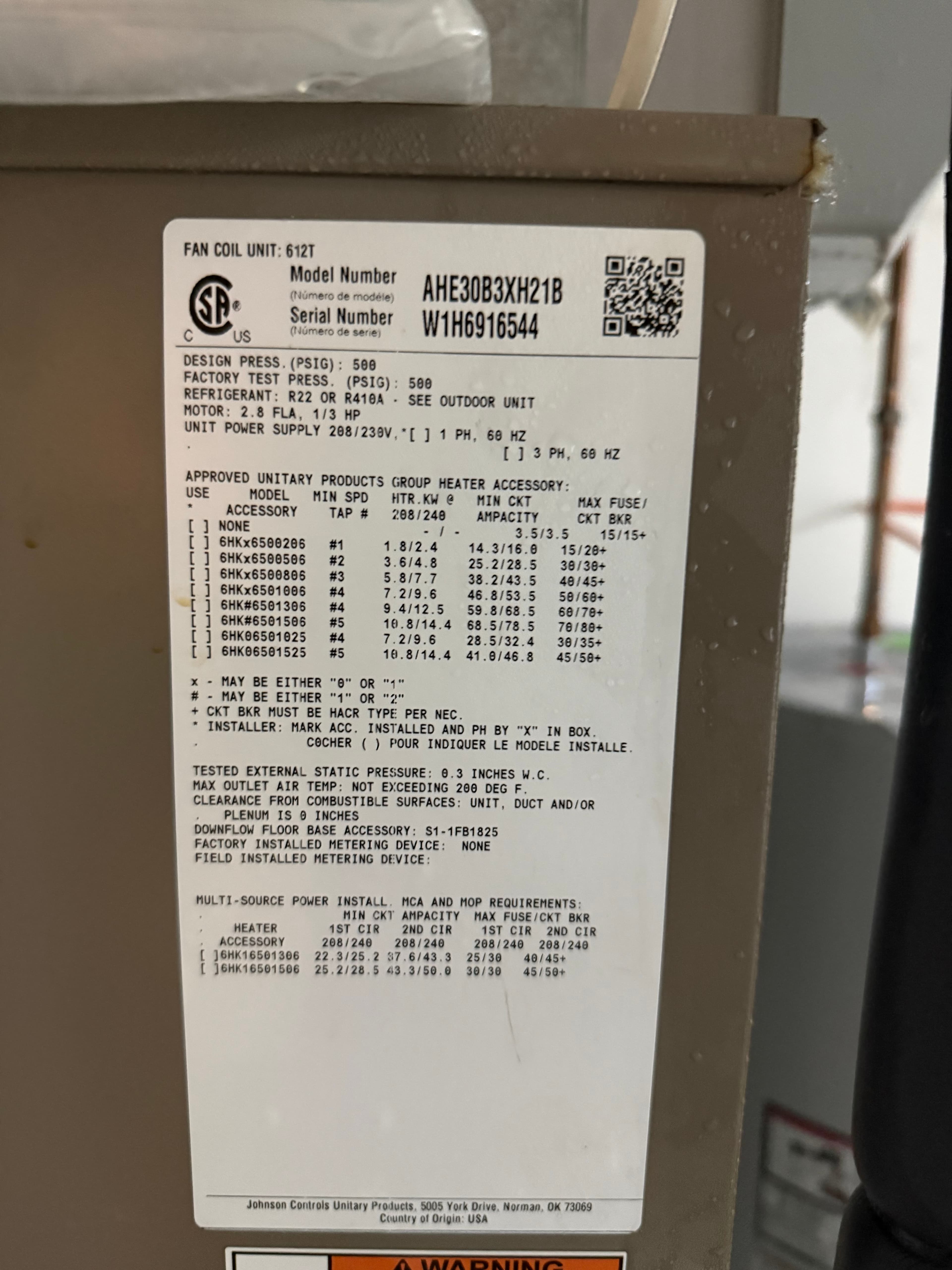 HVAC fan coil unit data plate, photographed during a real FLOW inspection
